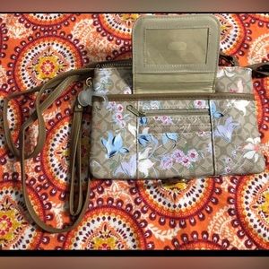 Women’s crossbody shoulder wristlet wallet purse middle and  front  pockets.